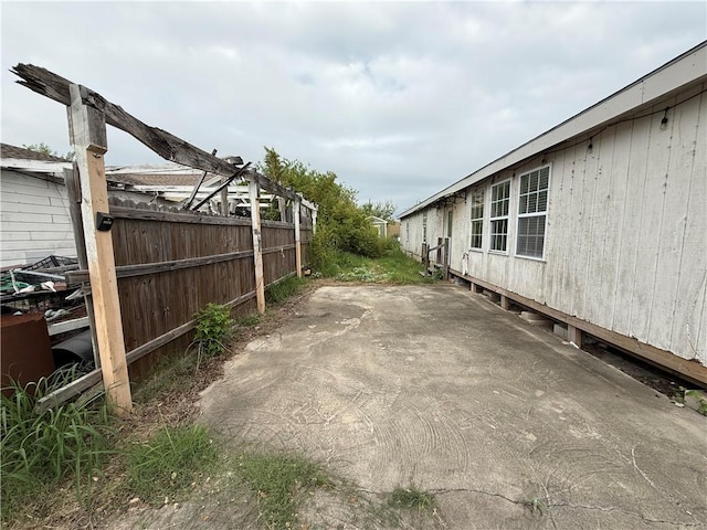 exterior space with a patio and fence