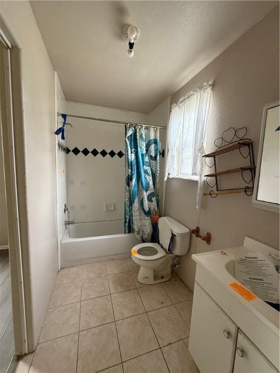 bathroom with toilet, tile patterned floors, shower / bathtub combination with curtain, and vanity