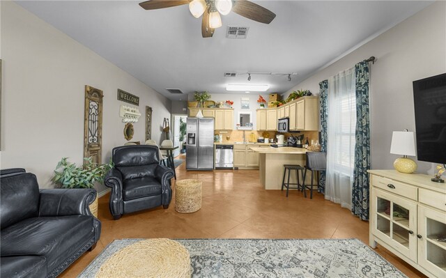 15209 S Padre Island Dr Unit 707, Corpus Christi, TX 78418 - living room with ceiling fan and light tile patterned floors