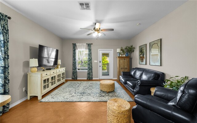 15209 S Padre Island Dr Unit 707, Corpus Christi, TX 78418 - living area featuring a ceiling fan, light tile patterned floors, and baseboards