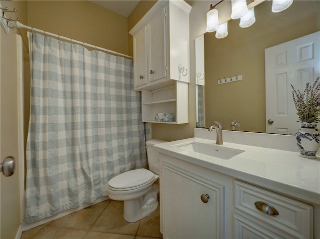 bathroom with vanity, tile patterned floors, and toilet