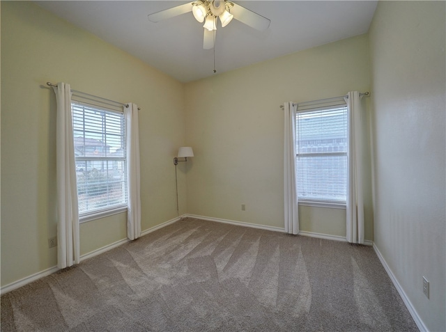 empty room with light carpet and ceiling fan