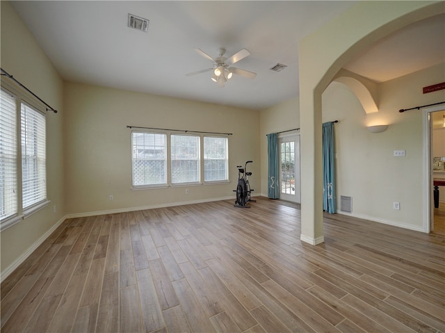 empty room with light hardwood / wood-style floors and ceiling fan