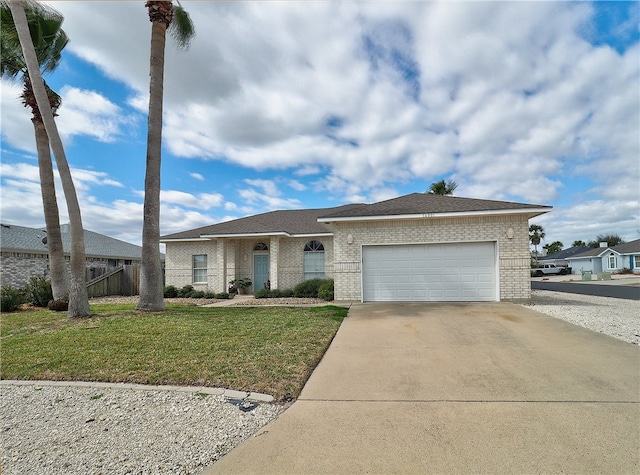 view of front facade featuring a garage and a front lawn