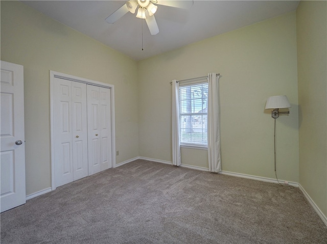 unfurnished bedroom featuring a closet, light colored carpet, and ceiling fan