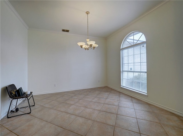 spare room with a chandelier, light tile patterned floors, and ornamental molding