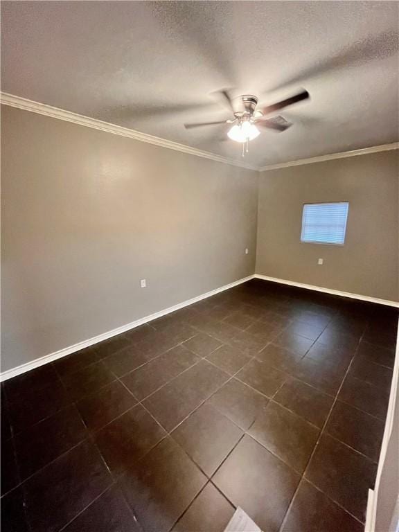 630 Sharon Dr, Corpus Christi, TX 78412 - unfurnished room with a ceiling fan, dark tile patterned flooring, and crown molding
