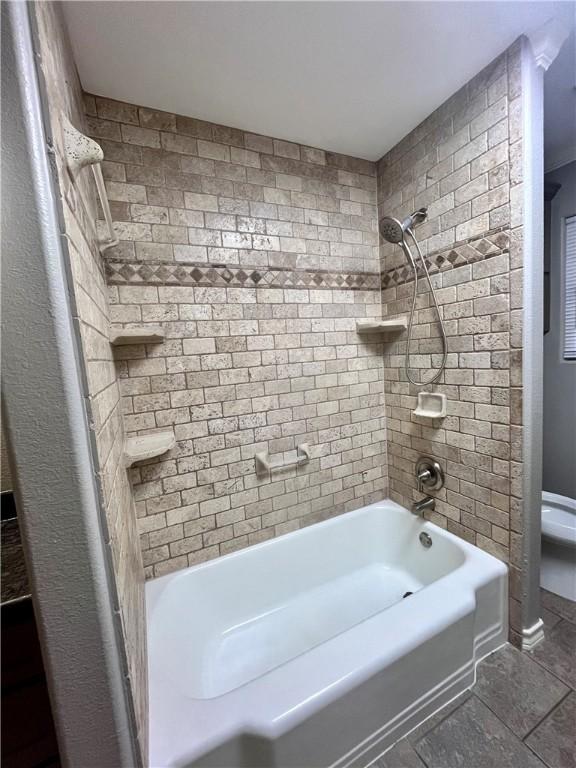 630 Sharon Dr, Corpus Christi, TX 78412 - full bathroom with washtub / shower combination and tile patterned flooring