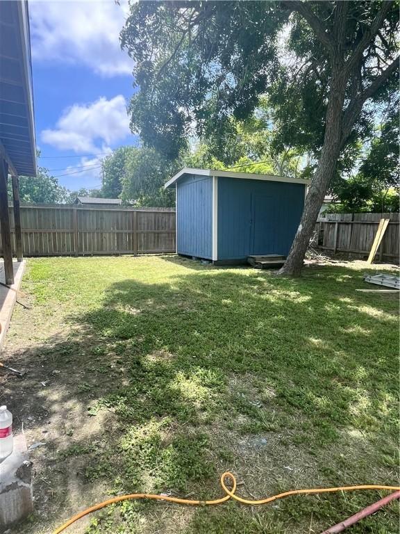 630 Sharon Dr, Corpus Christi, TX 78412 - fenced backyard with a storage unit