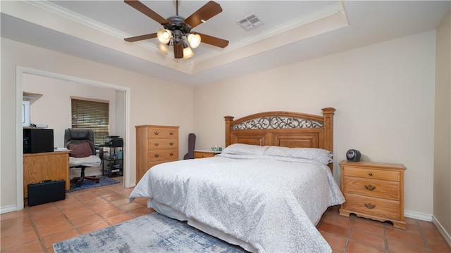 tiled bedroom with ornamental molding, ceiling fan, and a raised ceiling