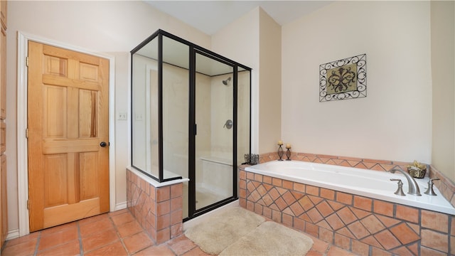 bathroom featuring separate shower and tub