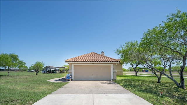 view of front facade with a garage and a front yard