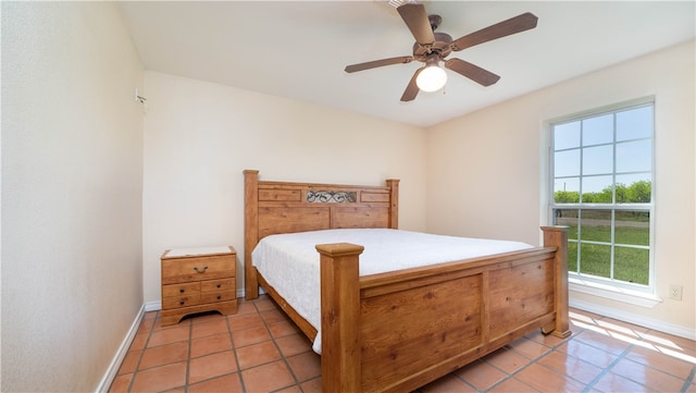 bedroom featuring ceiling fan and light tile patterned floors