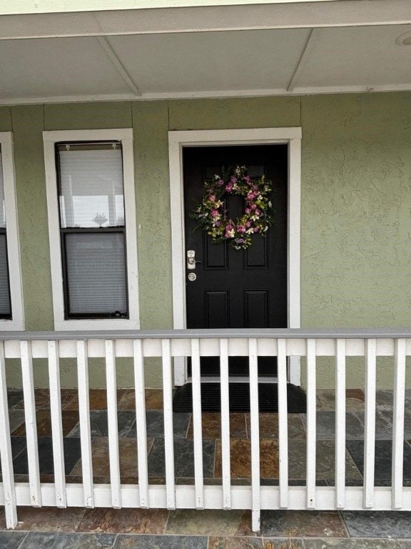 entrance to property with a porch