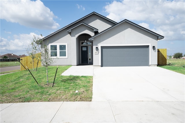 ranch-style house with a front yard and a garage