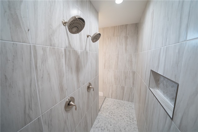 bathroom featuring tiled shower