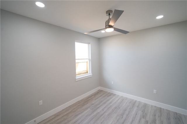 unfurnished room with ceiling fan and light hardwood / wood-style floors