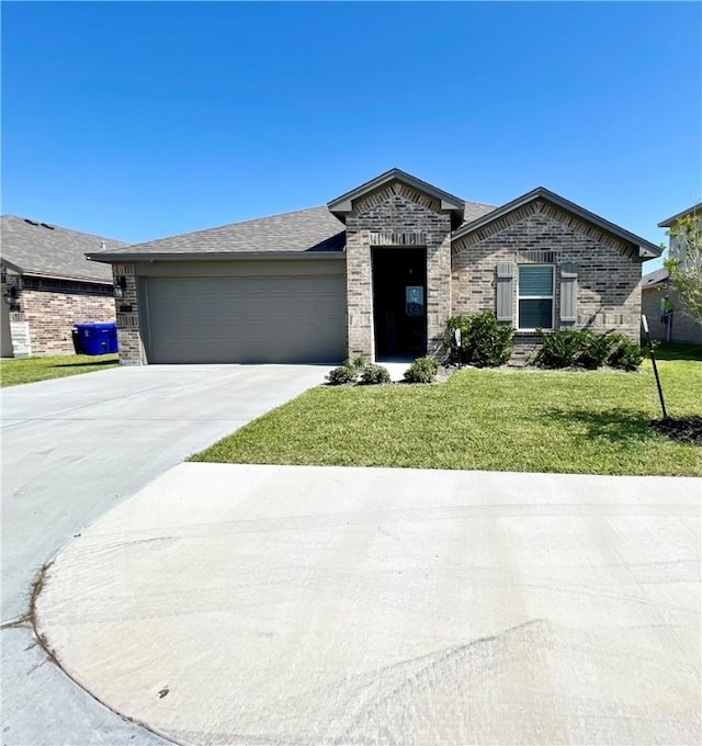 view of front of house with a garage and a front yard