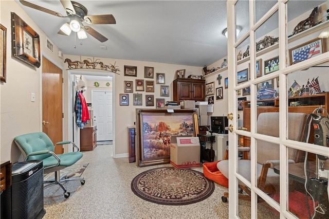 interior space featuring ceiling fan