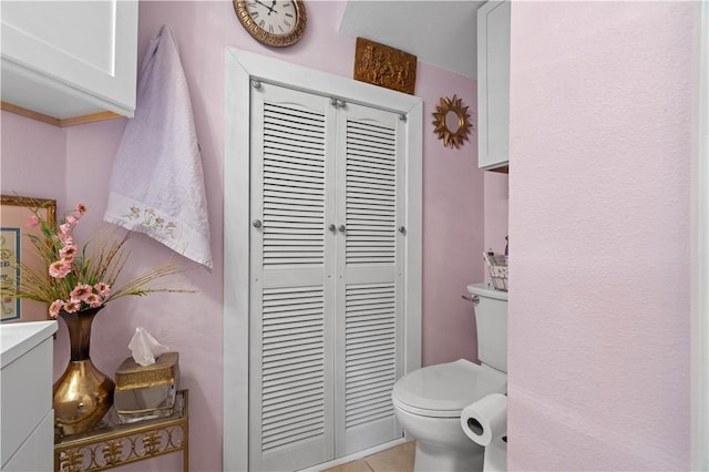 bathroom featuring tile patterned floors and toilet