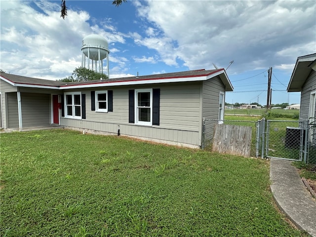 view of side of property with a yard