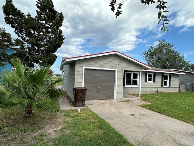 view of front facade with a garage and a front lawn