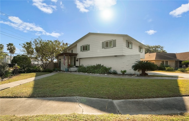 6845 Aswan Dr, Corpus Christi, TX 78412 - tri-level home featuring brick siding and a front yard