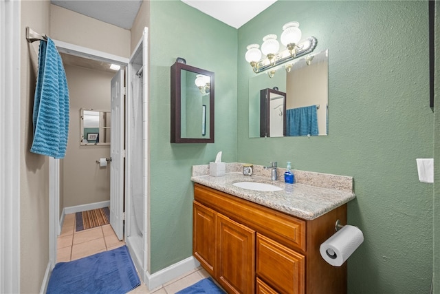 6845 Aswan Dr, Corpus Christi, TX 78412 - full bath with tile patterned floors, vanity, and a shower with shower curtain