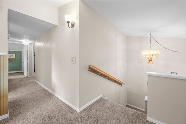 6845 Aswan Dr, Corpus Christi, TX 78412 - corridor featuring an upstairs landing, carpet floors, and a chandelier