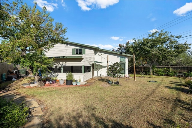 6845 Aswan Dr, Corpus Christi, TX 78412 - back of house featuring a sunroom