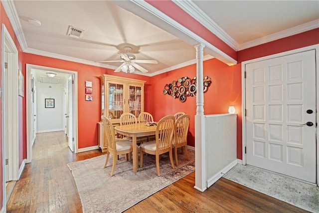 305 Circle Dr, Corpus Christi, TX 78412 - dining space featuring a ceiling fan, attic access, wood finished floors, crown molding, and baseboards