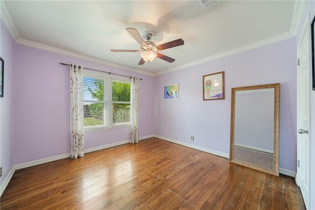 305 Circle Dr, Corpus Christi, TX 78412 - empty room with a ceiling fan, ornamental molding, wood finished floors, and baseboards