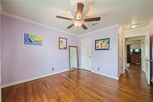 305 Circle Dr, Corpus Christi, TX 78412 - unfurnished bedroom featuring crown molding, baseboards, wood finished floors, and a ceiling fan