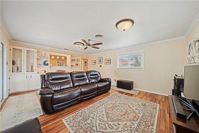 305 Circle Dr, Corpus Christi, TX 78412 - living area with ornamental molding, a ceiling fan, wood finished floors, and baseboards