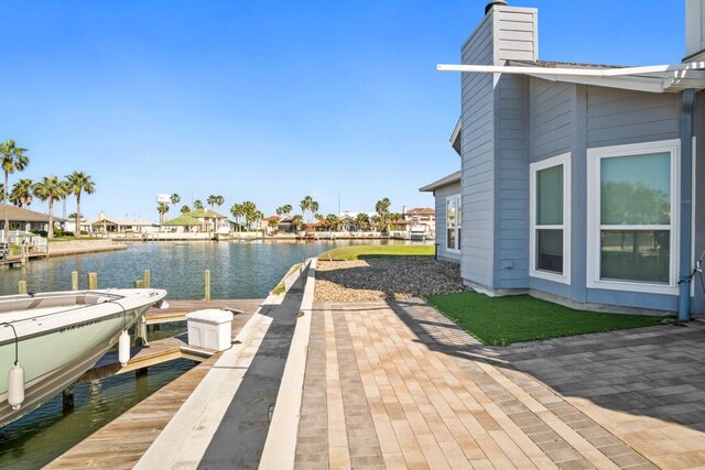112 Dolphin Ct, Aransas Pass, TX 78336 - dock area featuring a water view and a residential view