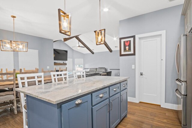 112 Dolphin Ct, Aransas Pass, TX 78336 - kitchen with freestanding refrigerator, dark wood-type flooring, a ceiling fan, baseboards, and vaulted ceiling