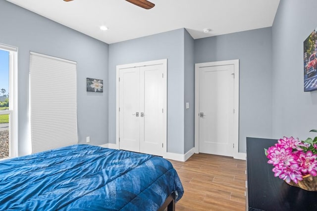 112 Dolphin Ct, Aransas Pass, TX 78336 - bedroom with wood finished floors, baseboards, ceiling fan, a closet, and recessed lighting