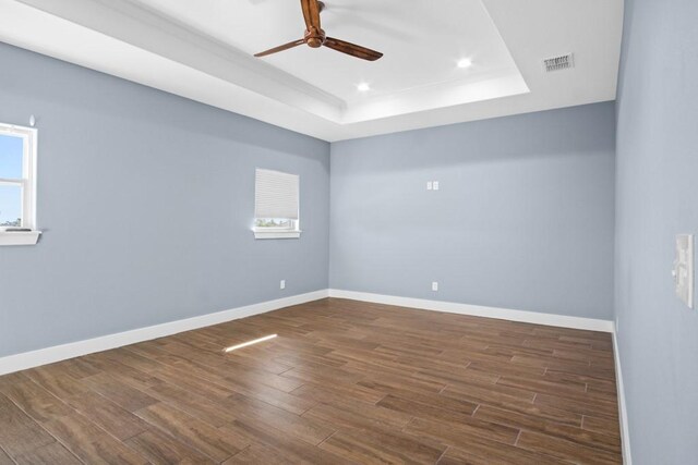 112 Dolphin Ct, Aransas Pass, TX 78336 - unfurnished room with a tray ceiling, ceiling fan, wood finished floors, baseboards, and recessed lighting