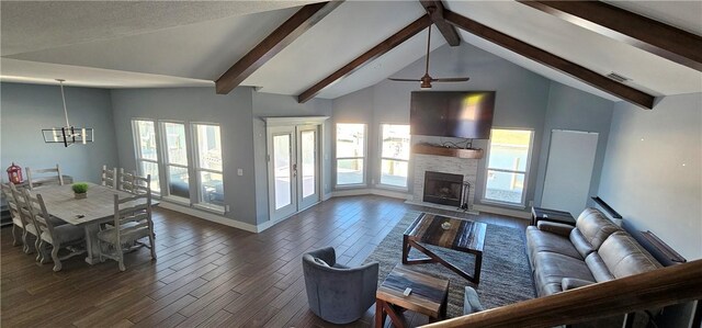 112 Dolphin Ct, Aransas Pass, TX 78336 - living room featuring a ceiling fan, dark wood-style floors, a chandelier, a fireplace, and baseboards
