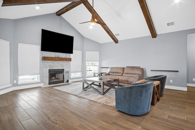 living room featuring ceiling fan, beam ceiling, high vaulted ceiling, a fireplace, and dark hardwood / wood-style flooring