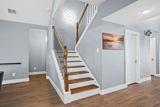 staircase featuring hardwood / wood-style flooring