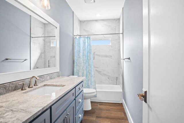 112 Dolphin Ct, Aransas Pass, TX 78336 - full bath featuring vanity, toilet, wood finished floors, shower / bath combo, and baseboards