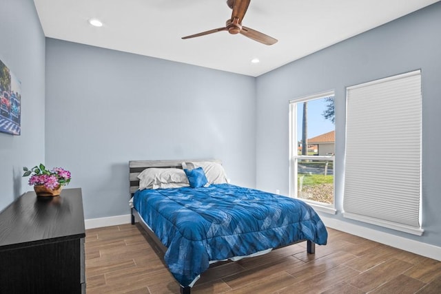 112 Dolphin Ct, Aransas Pass, TX 78336 - bedroom featuring wood finished floors, baseboards, recessed lighting, and a ceiling fan