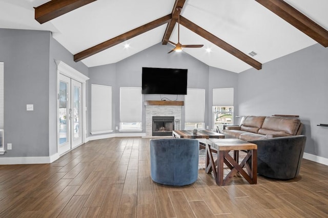 112 Dolphin Ct, Aransas Pass, TX 78336 - living room featuring beam ceiling, wood finished floors, baseboards, high vaulted ceiling, and a ceiling fan