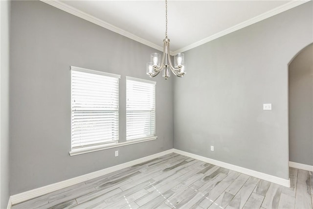 empty room featuring light wood-style floors, baseboards, arched walkways, and crown molding