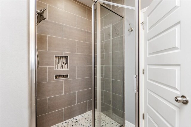 bathroom featuring a stall shower