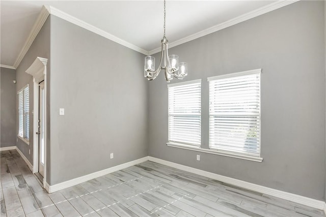 empty room featuring baseboards, a chandelier, and crown molding