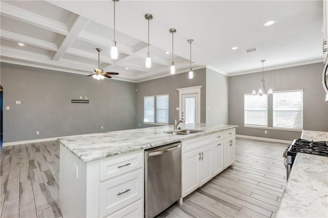 kitchen featuring a center island with sink, stainless steel appliances, open floor plan, white cabinetry, and light stone countertops