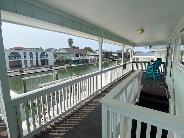 wooden deck with a water view