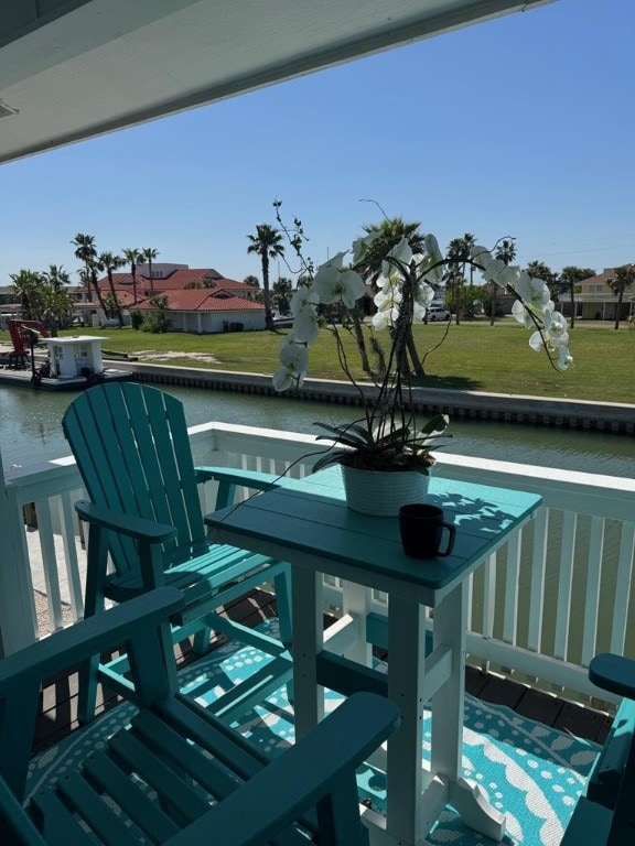 wooden deck with a water view